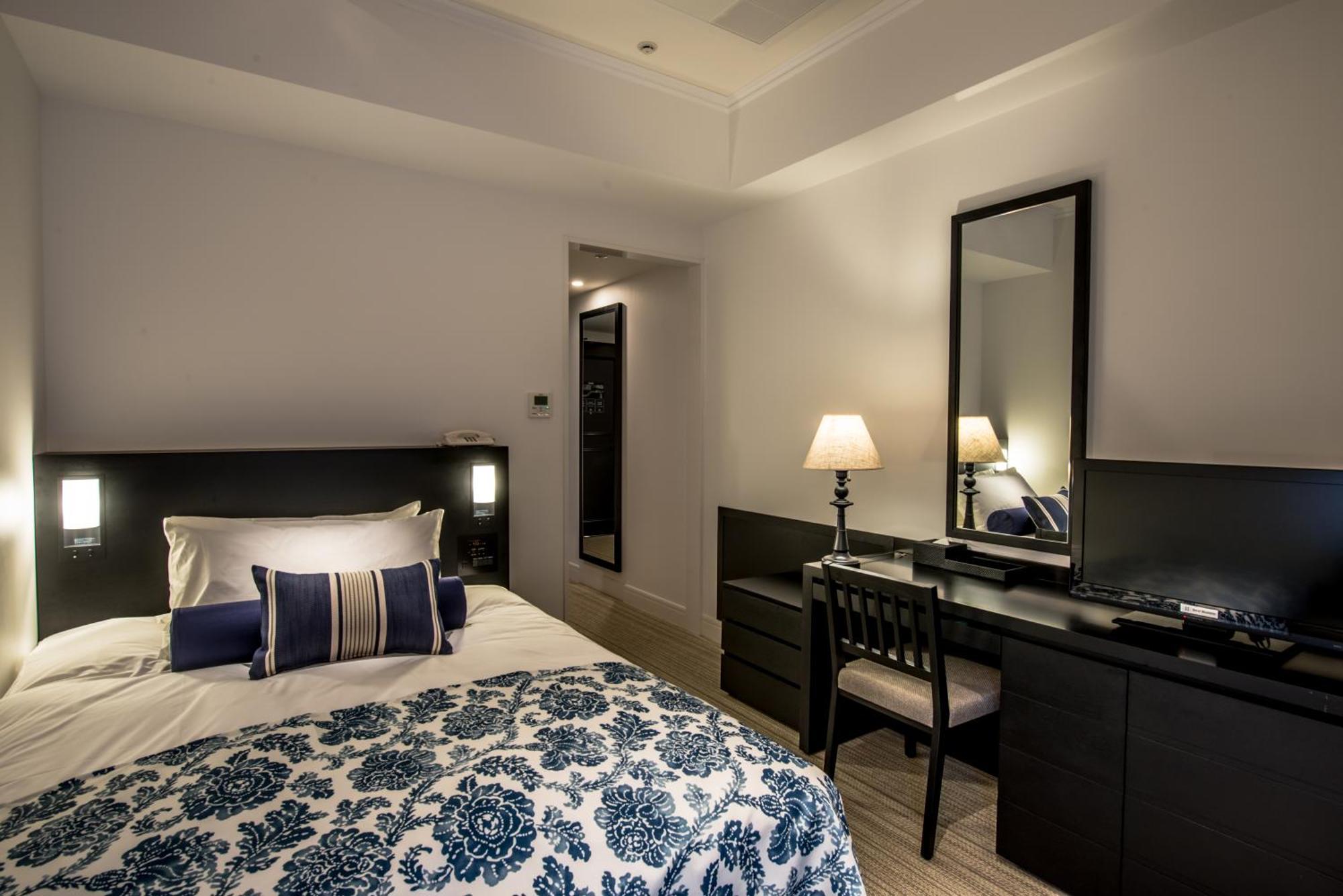 Hotel Monterey Okinawa Spa & Resort Онна Екстер'єр фото A bedroom at the hotel